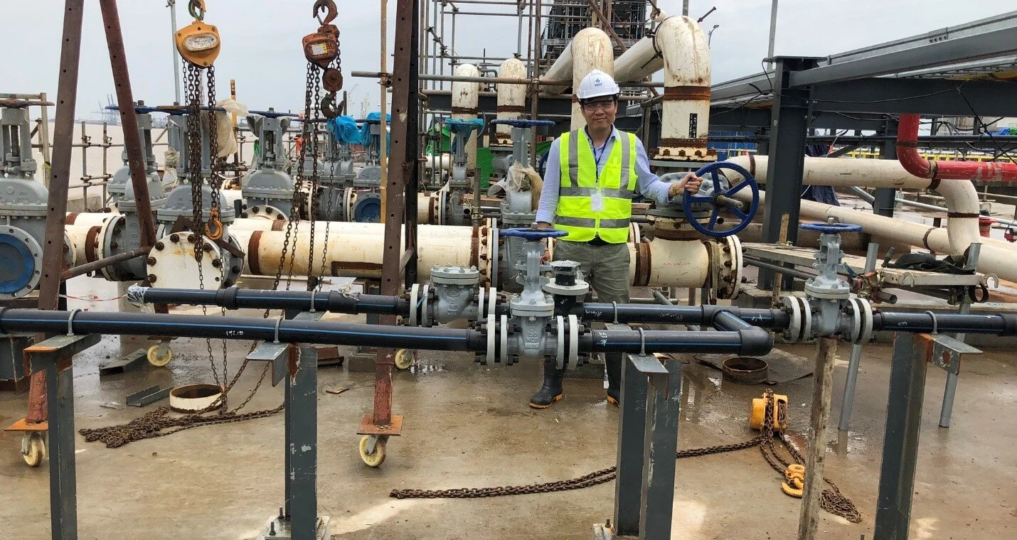 Engineer checking a valve line on site